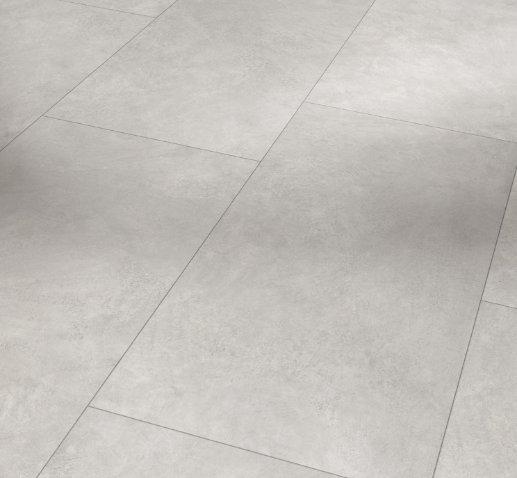 Close-up of light gray oversized tiled floor with geometric pattern