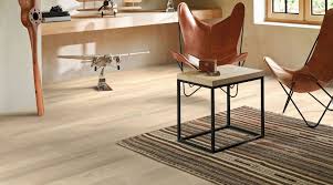 Modern room with wooden floor, chair, and desk.