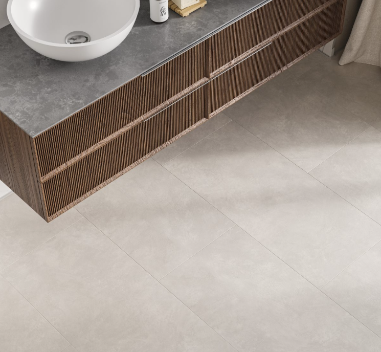 Bathroom vanity with a sink and tiled floor