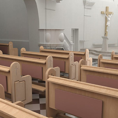 Several rows of Pews in a church with ECOSUN K+ INFRARED PANELS FITTED to the pews