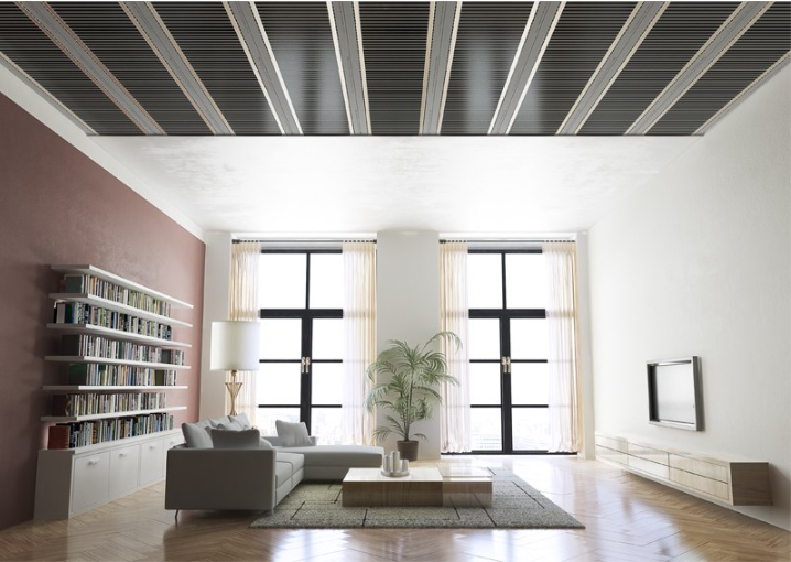 Modern living room with bookshelf, sofa, coffee table, and large windows. Ecofilm C fitted on Ceiling.