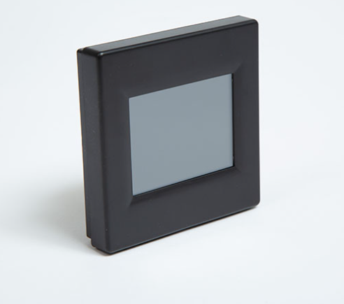 Black square electronic device with a transparent cover on a white background