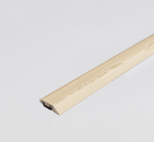 Light brown adapting profile. Wooden strip on a light background. Matches flooring perfectly.