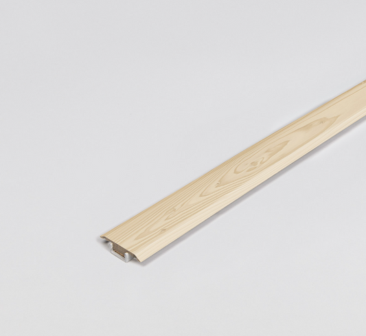 Wooden strip tranition profile on a light gray background