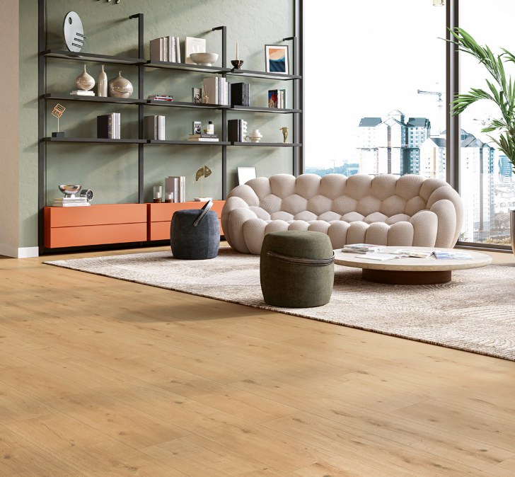 Modern living room with a beige sofa, round coffee table, and shelves with decorative items and Oak-Atmosphere-natural luxury vinyl floor.