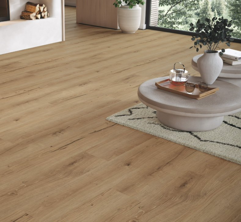 Wooden flooring with a coffee table and decorative items in a living room setting.