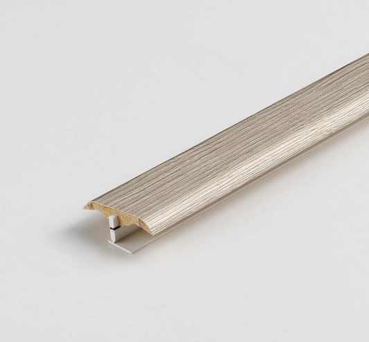 Wooden strip PROFILE in grey with metal clip on a light gray background. Matches laminate floor. 