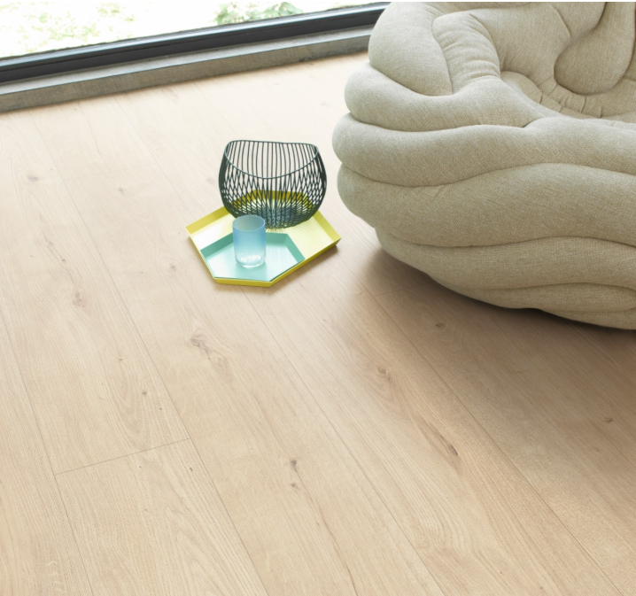 Light Oak Atmosphere Sanded  wood flooring with a modern chair and small table in the corner.