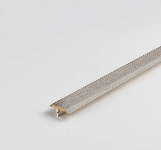 Wooden floor trim on a light gray background