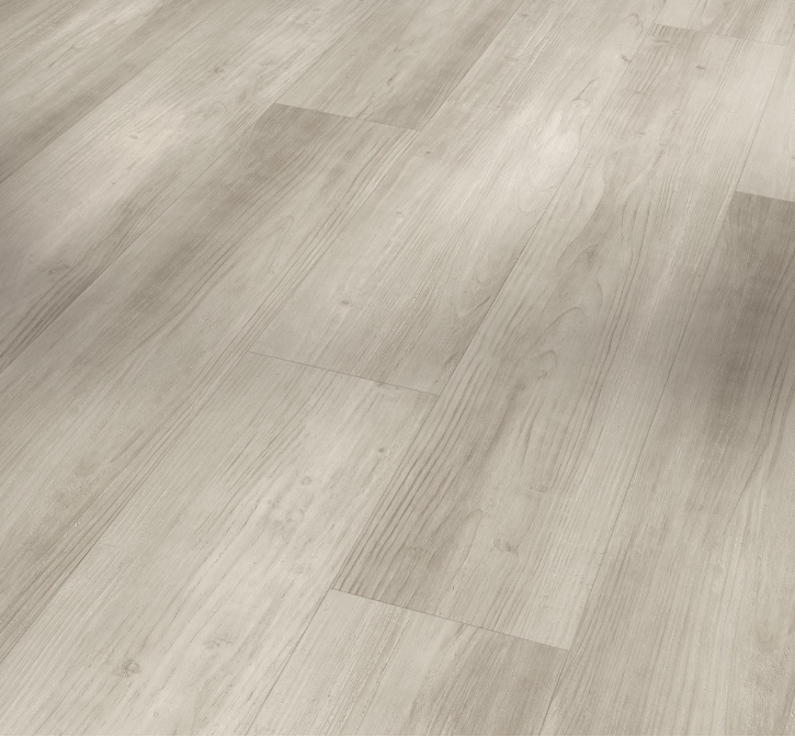Close-up of a wooden floor with a light brown color and visible grain pattern.
