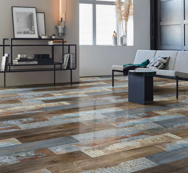 Living room with a patterned floor, sofa, and decorative items.