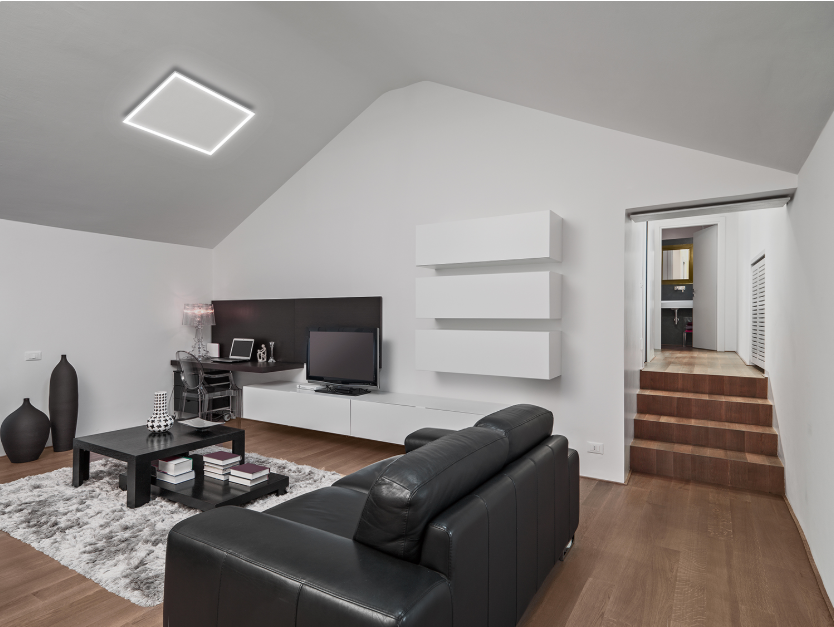 Modern living room with XLS LED infrared panel heater delivering efficient, ceiling-front-lit ceiling heating