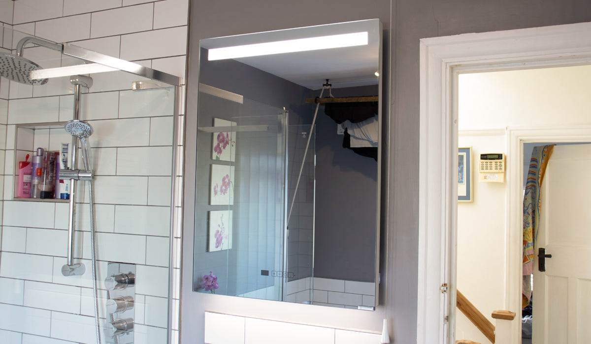 Insitu-Bathroom-Heated-Mirror-with-Lights on beside a shower.