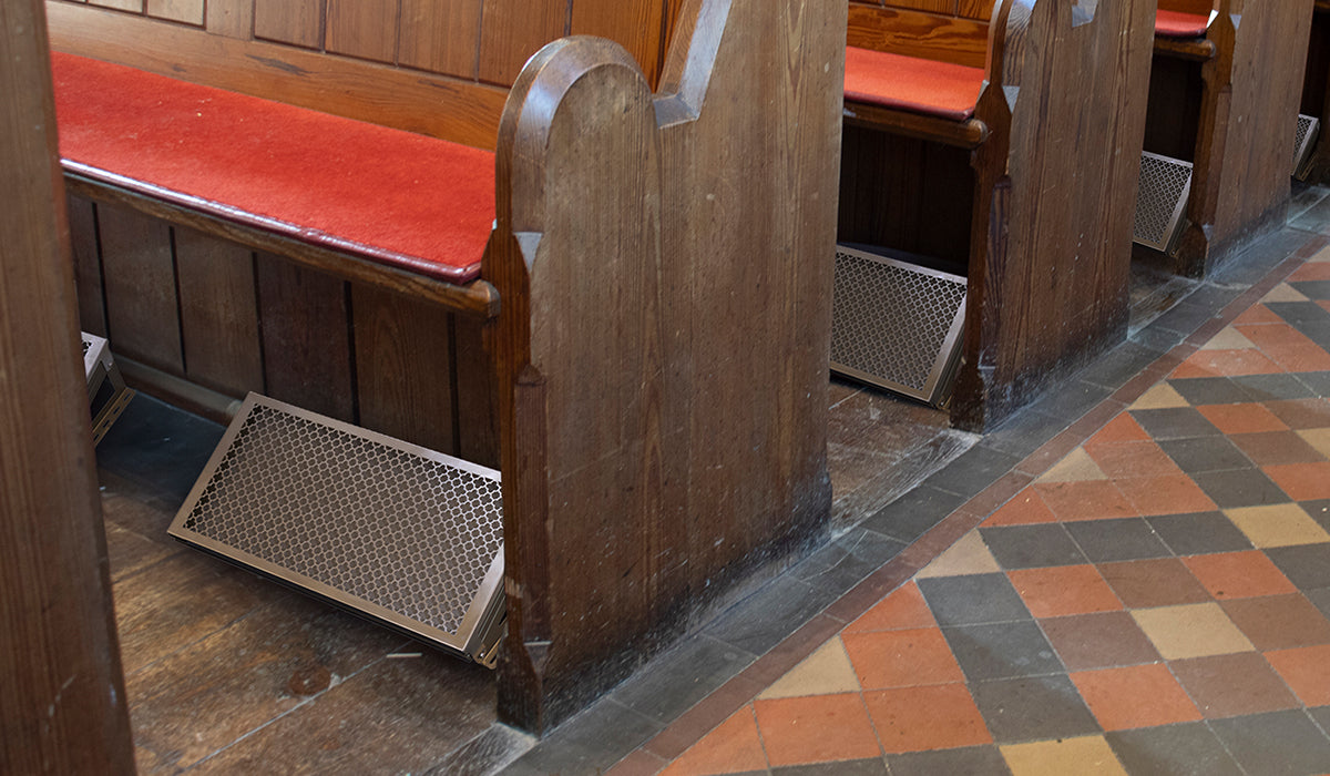 under pew heaters in a church with pews