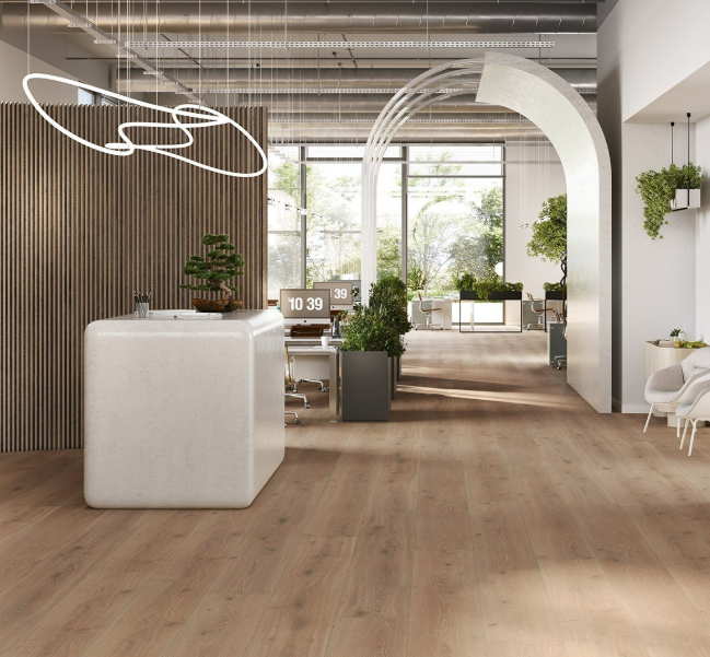 Modern office interior with installed oak castell limed laminate, white furniture, and large windows.