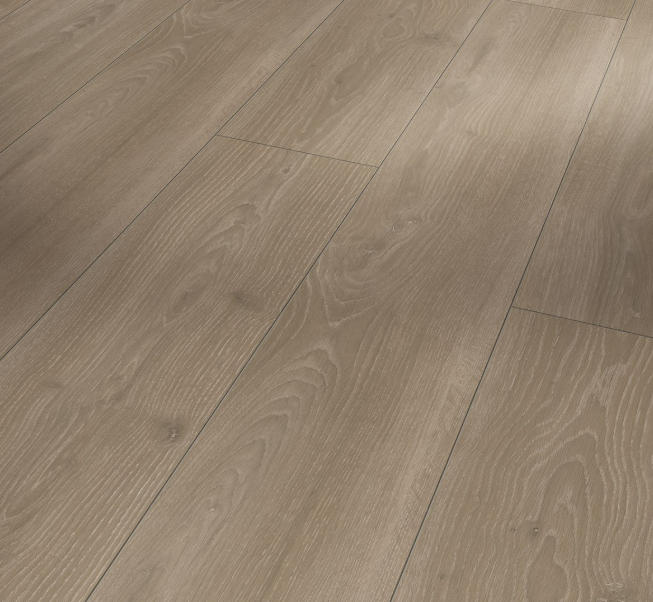 Extra-long château plank format of Parador Trendtime 6 laminate flooring at an angle that shows of the medium brown laminate