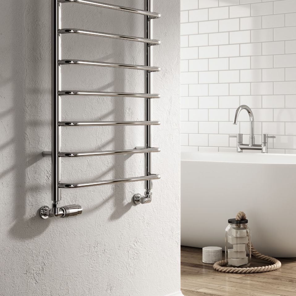Towel radiator mounted on a wall in a bathroom setting with a bathtub and faucet.