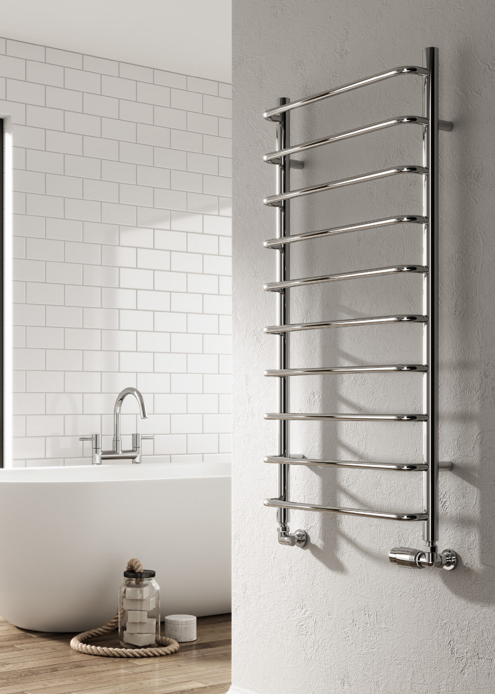Chrome towel radiator mounted on a bathroom wall with a bathtub and mirror in the background.