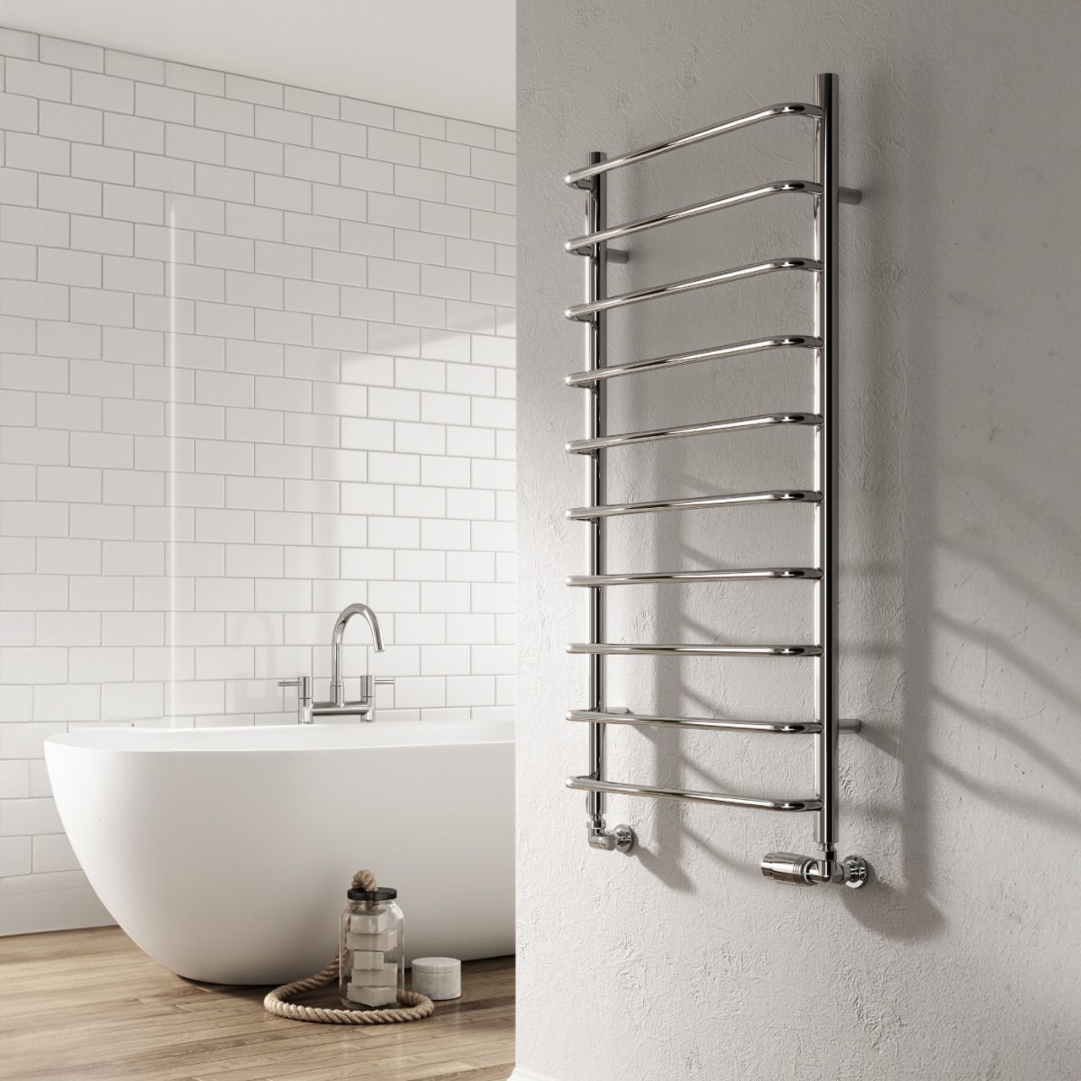 Chrome towel radiator mounted on a gray wall next to a white bathtub with a tiled bathroom.